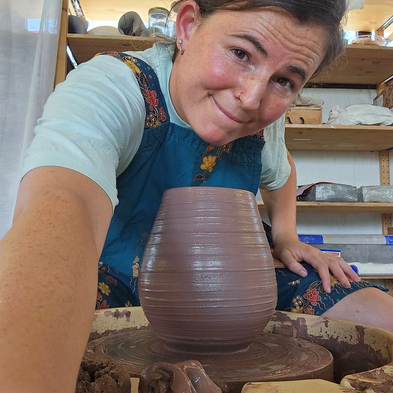 Iris working at the pottery wheel