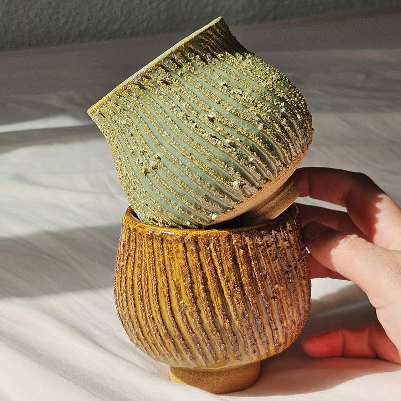 Two hand-built textured ceramic cups